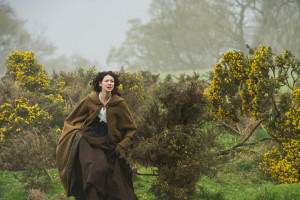 Claire running towards Craigh Na Dun - Picture from Outlander TV News