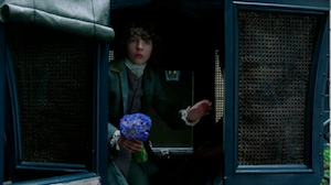Fergus holding blue flowers in Episode 207
